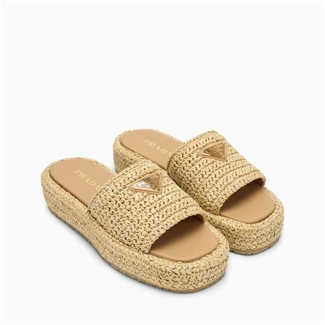 prada raffia slides.